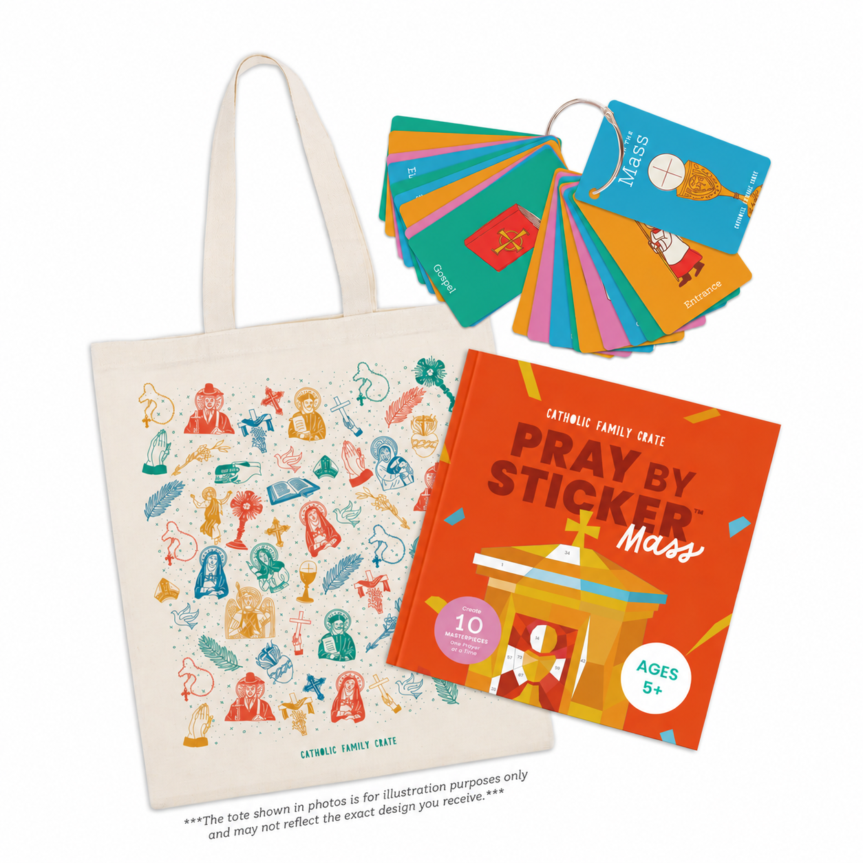 A canvas tote bag printed with colorful religious illustrations, shown with a fanned-out set of matching colorful cards and an orange book titled 'Pray by Sticker Mass'.