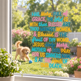 Hail Mary prayer window cling on a sunny window.
