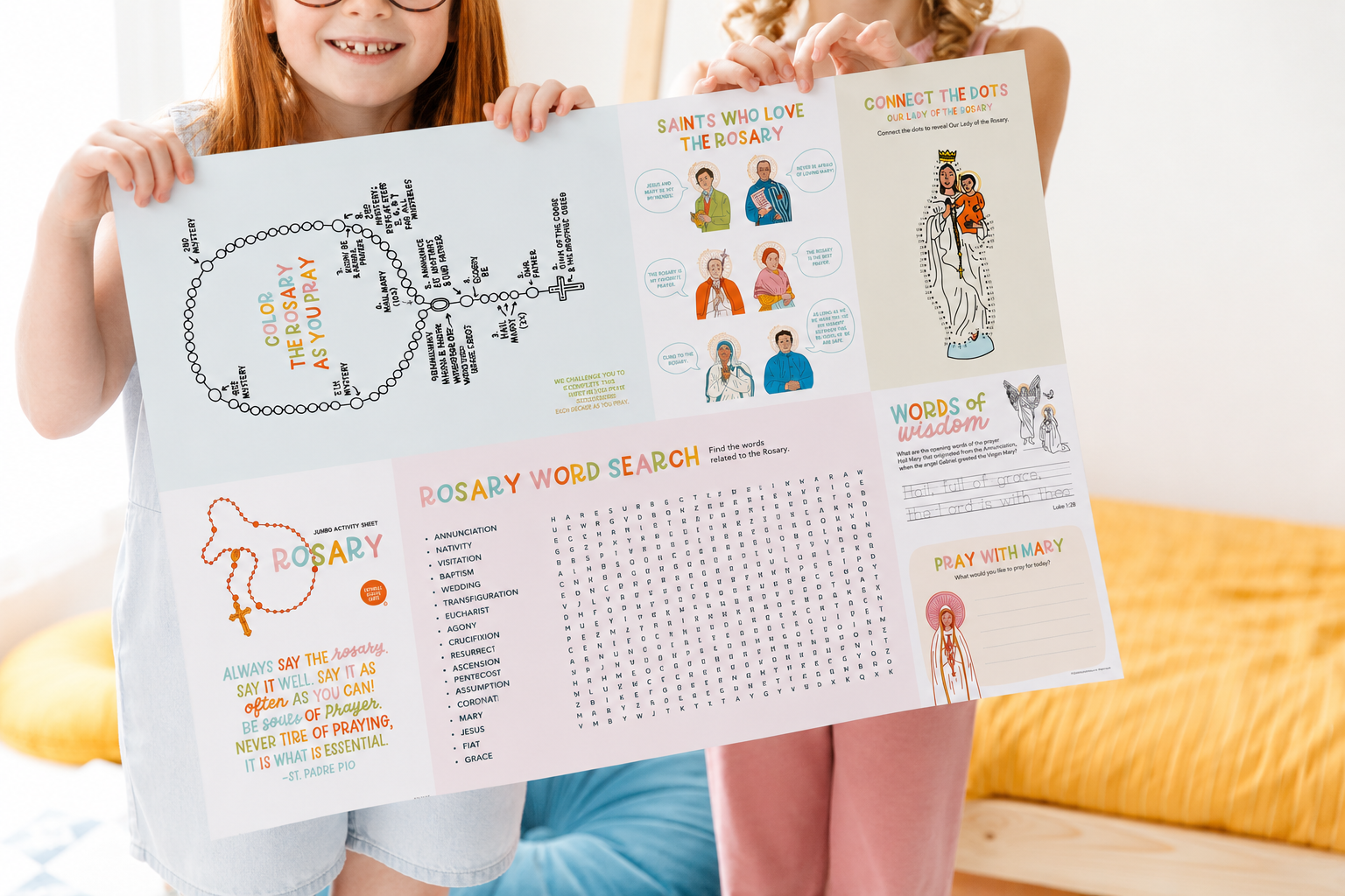 Two girls holding up the 24 x 18 inch Rosary Jumbo Activity Sheet